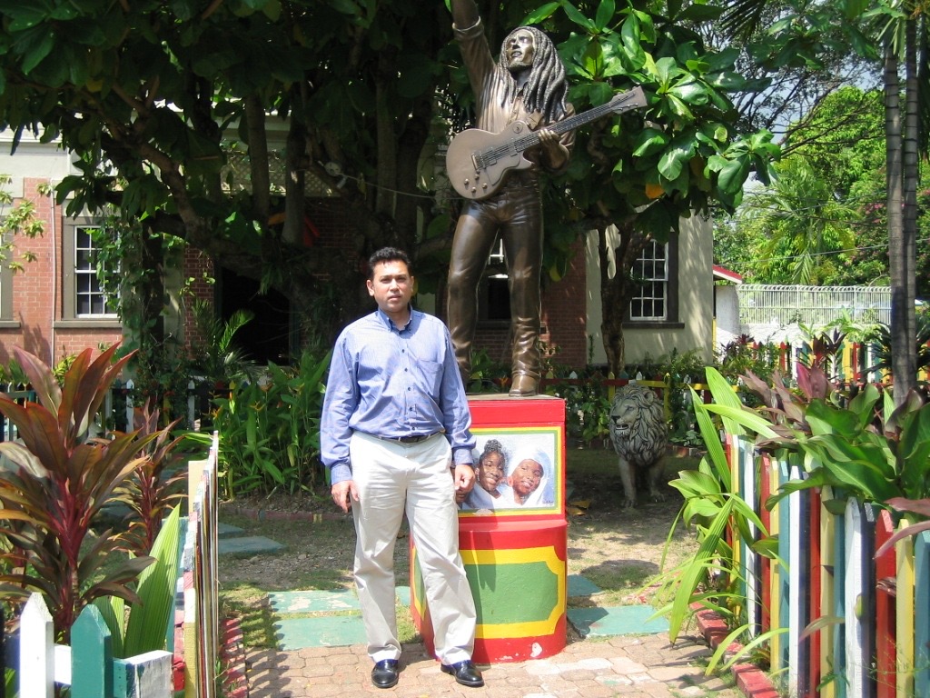 Faisal Hasnain in Jamaica with Bob Marley statue